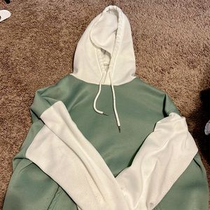 This is a very comfy oversized olive green and white sweatshirt